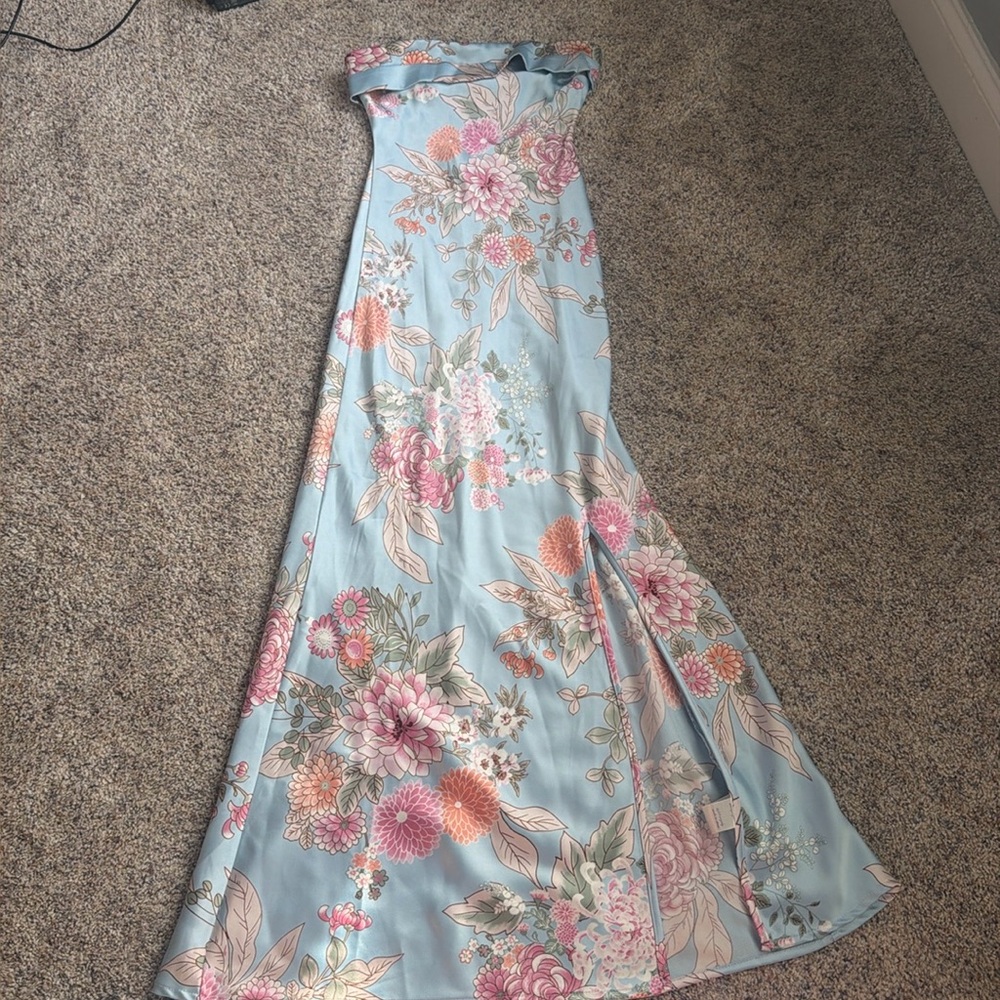 New without tags, strapless dress with slit on side.